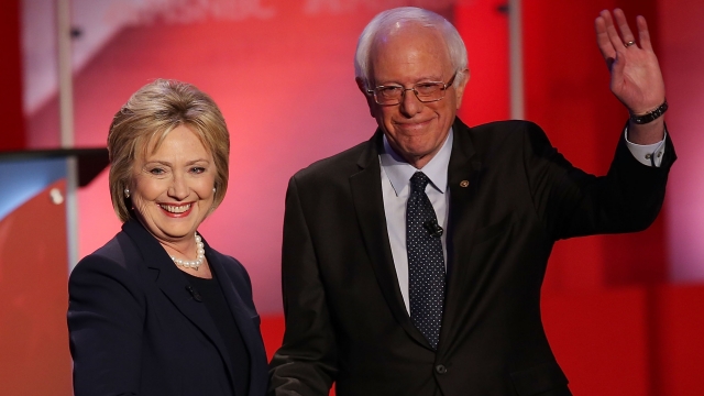 Clinton and Sanders shake hands before a debate in February.