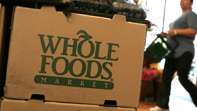 The Whole Foods logo on the side of a cardboard box