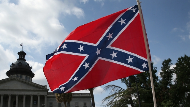 A group of demonstrators calls for the Confederate flag to remain on the outh Carolina State House grounds
