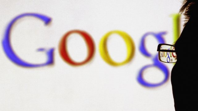 In this photo illustration, the logo of the multi-facetted internet giant Google is seen through a pair of glasses.