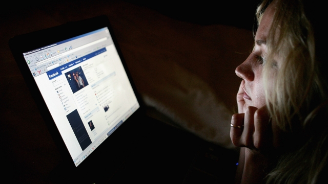 A girl browses Facebook.