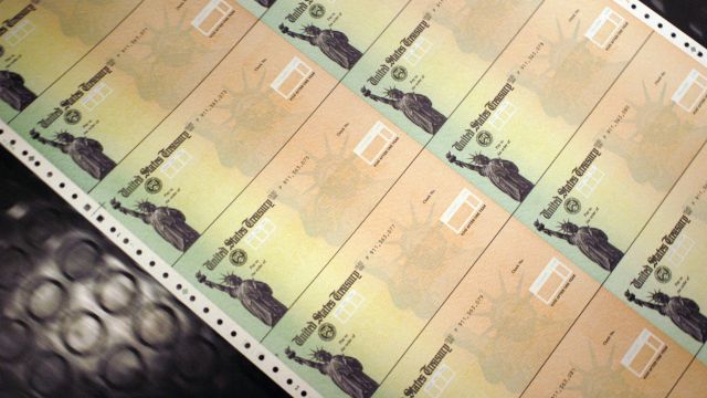 Blank Social Security checks are run through a printer at the U.S. Treasury.