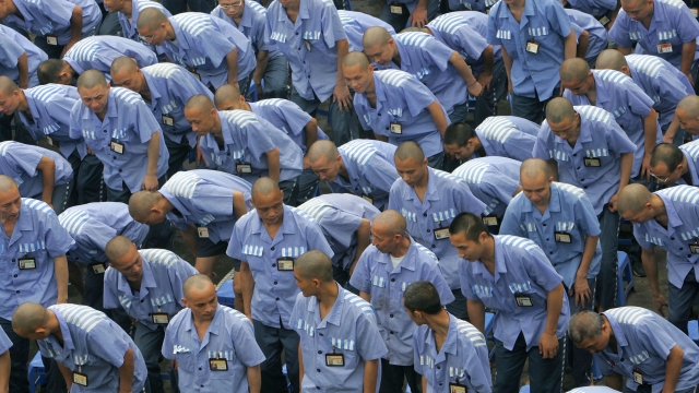 Inmates take their seat during a behavior training session at Chongqing Prison on May 30 in China.