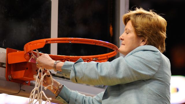 Head coach Pat Summitt of the Tennessee Lady Volunteers celebrates by cutting down the net after their 64-48 win.