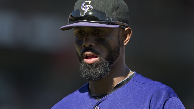 Jose Reyes, who served a domestic violence suspension this year, heads off the field during his time with the Rockies.