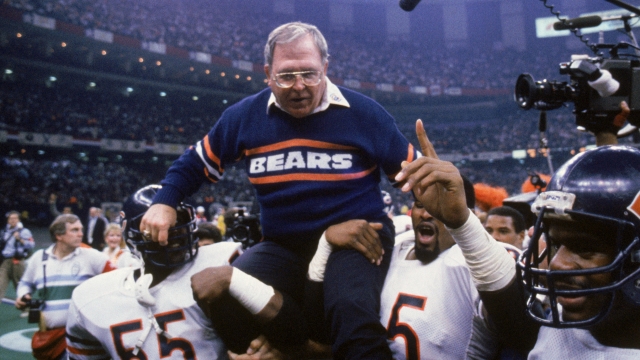 Defensive coordinator Buddy Ryan of the Chicago Bears gets carried off the field after Super Bowl XX.