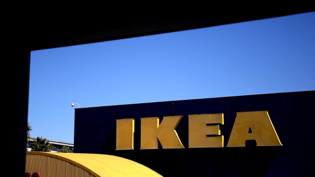 A sign is posted on the exterior of an IKEA store.