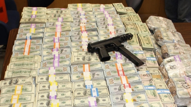 Polie seized $24 million from a home that's connected to a suspected marijuana trafficker.