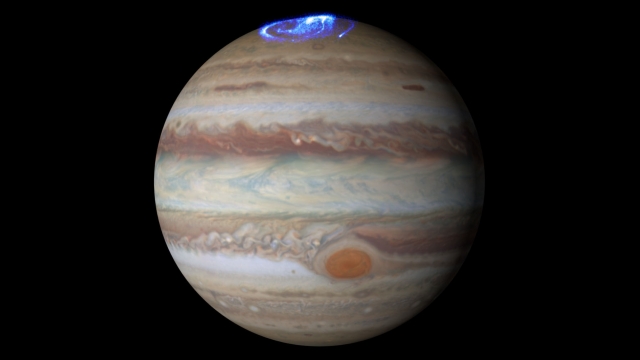 This composite image illustrates the auroras on Jupiter relative to their position on the giant planet.