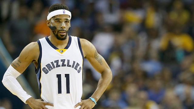 Mike Conley #11 of the Memphis Grizzlies watches the action against the Golden State Warriors.