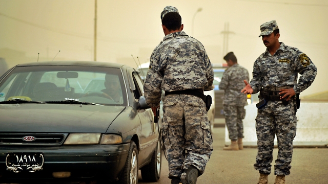 Iraqi soldiers and U.S. Soldiers hold random security checks during a security checkpoint mission in Abu T'Shir, Iraq.