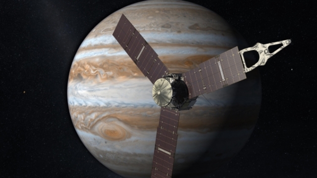 An artist's rendering of the Juno orbiter in front of Jupiter.