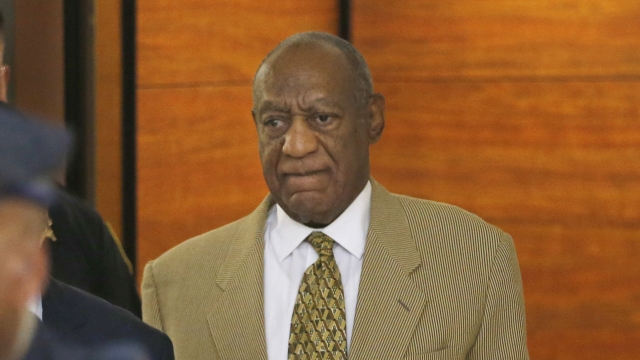 Bill Cosby enters the Montgomery County Courthouse after a hearing.