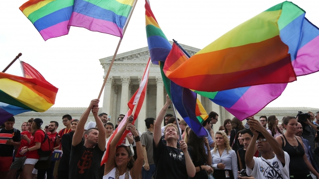 LGBTQ flags wave outside the U.S. Supreme Court.