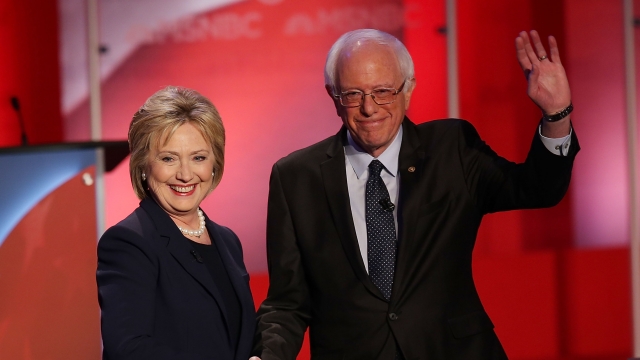 Hillary Clinton and Bernie Sanders shake hands at the start of their MSNBC Democratic Candidates Debate
