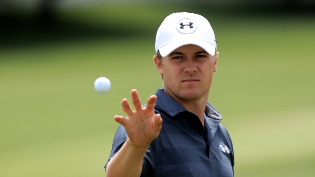 Jordan Spieth catches a ball on the practice range during the third round of the World Golf Championships.
