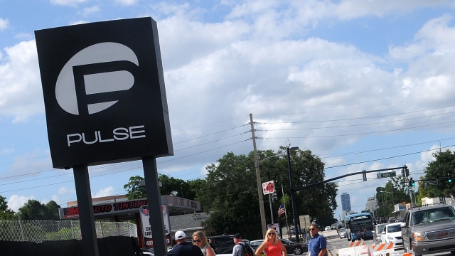 Vehicles cross in front of the Pulse Nightclub on June 21, 2016 in Orlando, Florida.