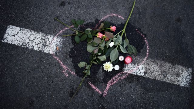 A floral tribute is laid on the ground where a person was killed on the Promenade des Anglais.