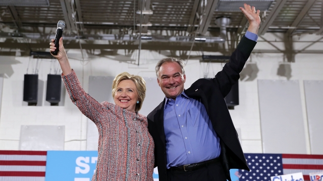 Hillary Clinton stands with Tim Kaine.