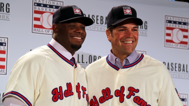 Ken Griffey Jr. and Mike Piazza, the two newest inductees in the National Baseball Hall of Fame, pose for pictures.