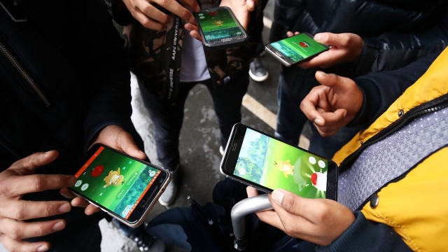 "Pokémon Go" players meet at a "Pokéstop"