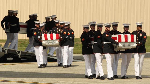 Soldiers carry caskets of ambassadors killed in Benghazi, Libya.