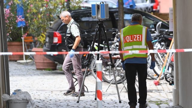 Forensics search the area of a suicide bomb attack at a music festival on July 25, 2016 in Ansbach, Germany.
