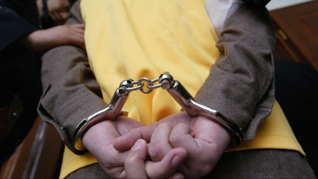 A man in handcuffs.