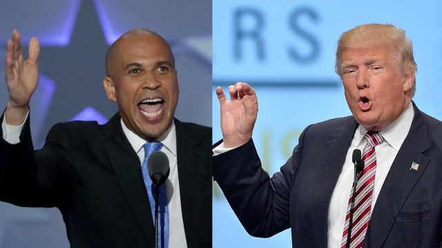 A split screen of Sen. Cory Booker wearing a black suit with blue tie and Donald Trump wearing a navy suit with red tie.
