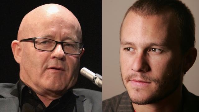 Side-by-side of Kim Ledger, bald, sitting and wearing black square glasses with a gray suit, and Heath Ledger with a buzz cut