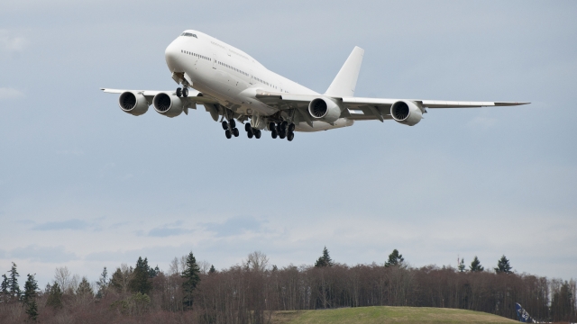 A Boeing 747 takes off for its delivery flight from Paine Field on Feb. 28.