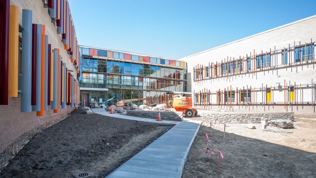 The courtyard at the new school in a photo taken in May 2016 shows a path with brightly colored designs on the windows.