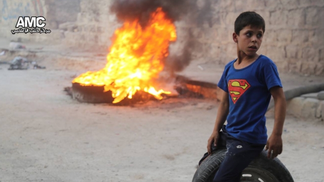 Kids are burning tires to create a no-fly zone in Aleppo, Syria.