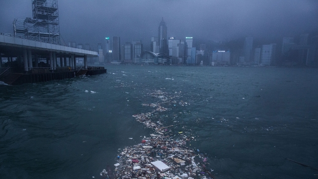Waves batter Victoria Harbour in Hong Kong after Typhoon Nida hit the city.
