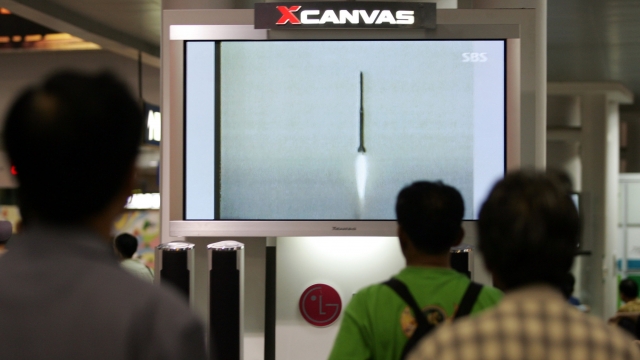 South Koreans watch file footage of a North Korean missile launch on a television screen on July 9, 2006, in Seoul.