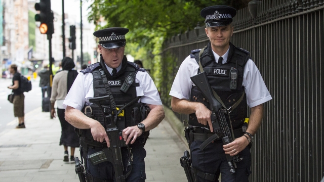 Armed officers walk the streets following London knife attack.