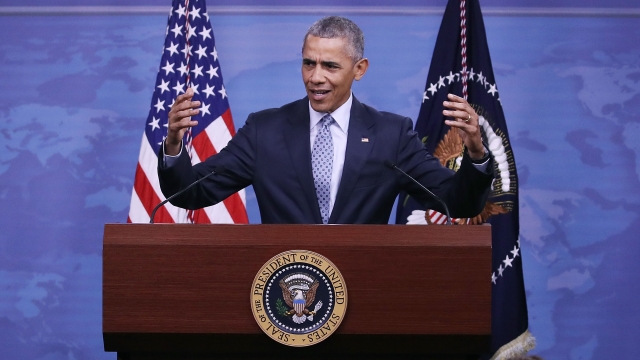 President Barack Obama speaking at a press briefing.