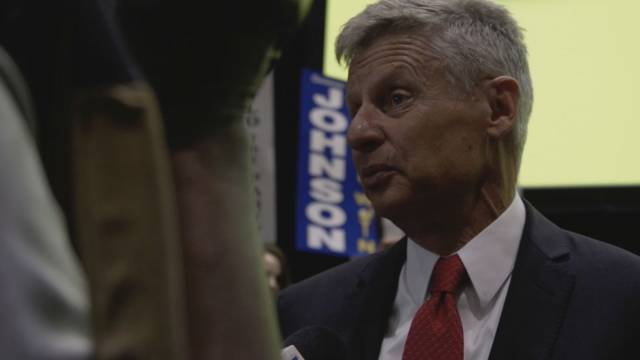 Gary Johnson speaks to reporters at a rally.