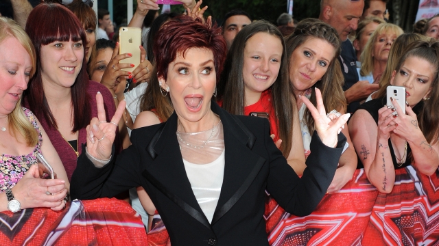 Sharon Osbourne poses with a crowd at the first auditions for the new "X Factor" season.
