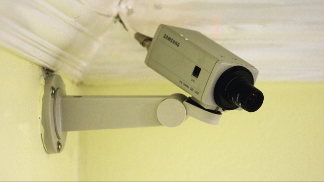 A camera operates inside a room.