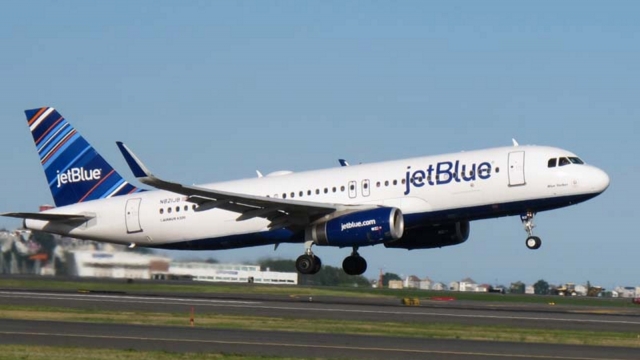 A JetBlue plane takes off.