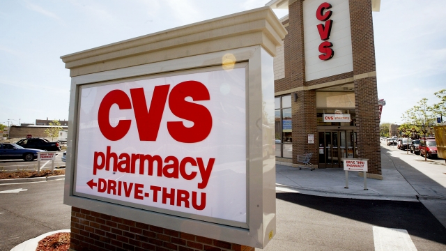 A sign marks the location of a new CVS pharmacy.