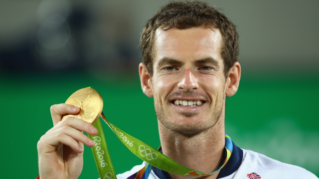 Gold medalist Andy Murray of Great Britain receives his gold medal for singles tennis during the 2016 Rio Olympics.