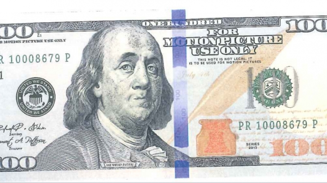 A fake $100 bill that has a stamp that says, "For Motion Picture Use Only."
