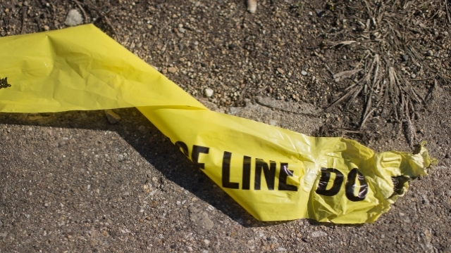 Crime scene tape on the ground