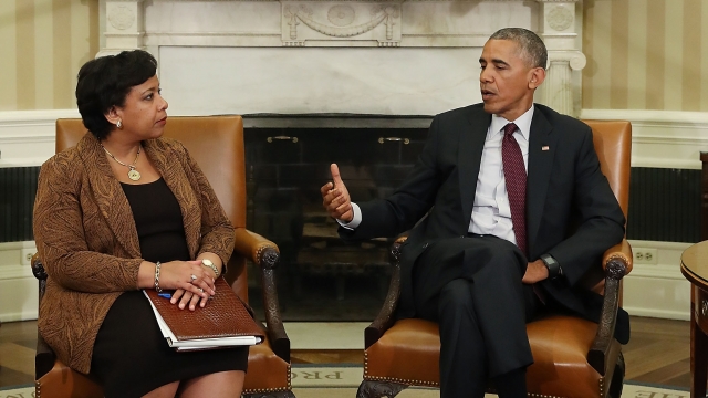 President Barack Obama and Attorney General Loretta Lynch talk in the Oval Office.
