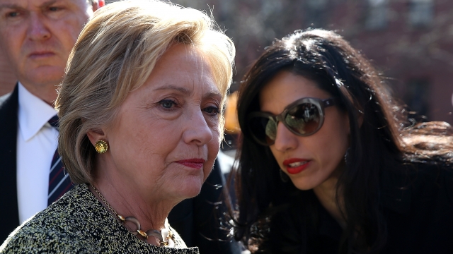 Democratic presidential candidate former Secretary of State Hillary Clinton talks with aide Huma Abedin.