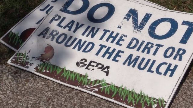 "DO NOT PLAY IN THE DIRT OR AROUND THE MULCH" where you live, signed, The EPA.