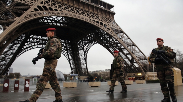 Armed security patrol the Eiffel Tower on Jan. 9, 2015, in Paris, France.