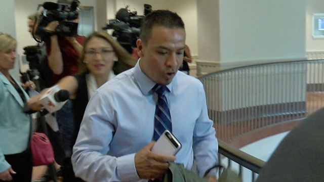 Carlos Hernandez Fernandez exiting a courtroom